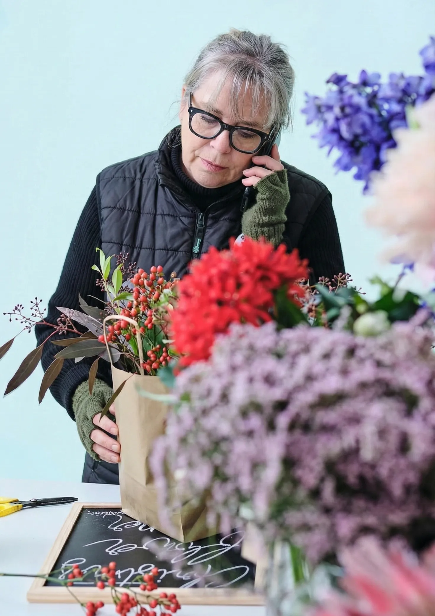 Phyllis answering a call at PJ's Petals