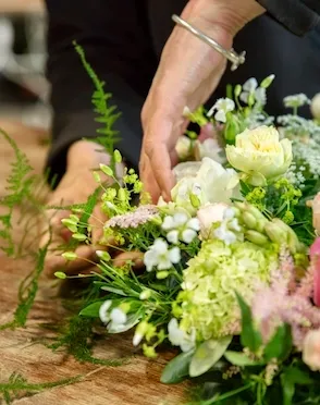Florist creating a bespoke gift bouquet in Dumfries